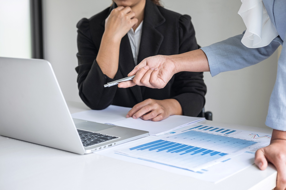 Boss Teaching Employee About Presentation